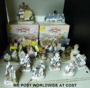 Twenty-three largely miniature David Winter cottages, two with boxes,