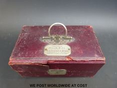 A cased travelling vanity set with presentation plaque 'Presented to Miss M.