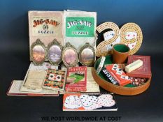 Two GWR wooden jigsaw puzzles and a collection of vintage games