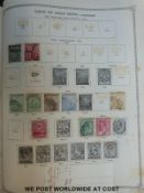 A box of all world stamp albums including Imperial Ideal albums (both sparsely filled)