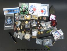 A large selection of metal and cloth badges to include several AAA Star award, lapel crowns,
