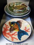 Nine Puichmont Pottery fish plates including some larger chargers