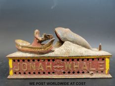 A cast iron Jonah and the Whale money box.