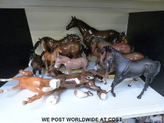 A collection of various Beswick horses, donkeys,
