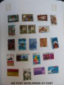 An album of Great Britain QEII stamps and an international stamp album of all world stamps