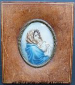 A leather framed miniature of a lady with baby (overall size 14cm x 12cm)