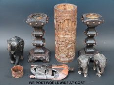 Three carved hardwood Indian elephants, together with a carved African mask,