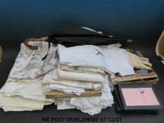 A collection of textiles to include kid gloves, Agnes Pascal silk scarf, Swiss linen handkerchiefs,