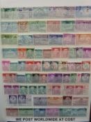 Commonwealth QEII stamps on loose album sheets and stockbooks of Middle East and USA stamps