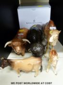 A boxed Royal Doulton Dulux dog figurine, together with Beswick Highland and Jersey cows,