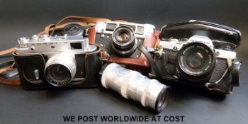 An Olympus OM10 SLR camera, Fed-4,