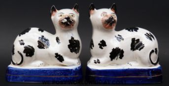 A pair of Staffordshire mantel cats