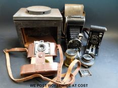 Three cameras and lenses including a 'Unicum' example