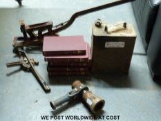 A set of Newnes motor repair books, an Esso two gallon can and three jacks,