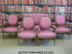 A giltwood Louis XVI style five piece salon suite with carved detail and spiralling legs