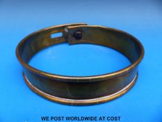 A Victorian brass dog collar with two slot and loop adjustments to take a padlock,