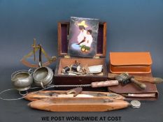 A collection of various items to include bobbins, brass balance, keys,