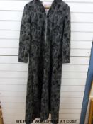 A ladies evening coat with satin lining together with a matching similar pattern skirt