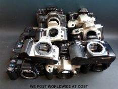 A box of cameras (22) including Canon, Minolta,