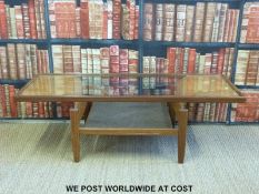 A retro bentwood and glass G-plan style coffee table (H36 x W70 x D51cm)