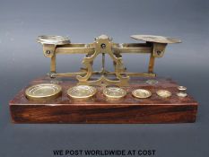 A Mordan set of postage scales with weights to base including two weights marked F (pre 1851)