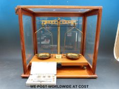 A cased set of Gallenkamp laboratory scales and a box of weights