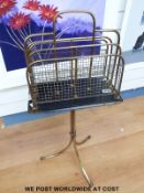 A brass magazine rack on tripod legs (H84 x W20cm)