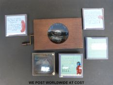 A mechanical magic lantern slide with a moving picture of fish together with a box of further