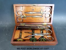 A cased five-piece paediatric tracheastomy set with ivorine label 