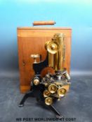 A cased Watson & Sons Ltd microscope with various lenses