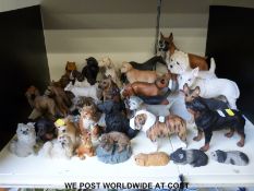 A large collection of resin dog and animal collectables including North Light