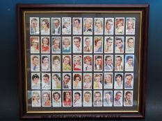 Nine framed and glazed sets of cigarette cards including railway, aircraft,