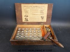 A cased apothecary Christy Cachet Machine 