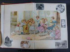 A late 19thC /early 20thC picture album with many prints by Louis Wain, A F Lydon and S T Dadd,