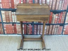 An oak school desk complete with ceramic inkwell c1900 (H80 x W56 x D46cm)