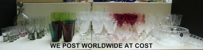 A large collection of glasses to include carafe and cups, Waterford style wine glasses,