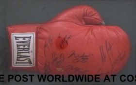 An Everlast boxing glove signed Muhammed Ali, Larry Holmes, Riddick Bowe, Evander Holyfield,
