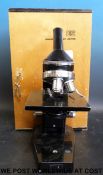 A cased Gillett & Sibert microscope