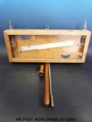 A Negretti & Zambra liquid gauge together with a brass thermometer in a wooden case