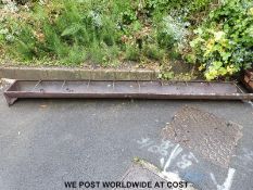 A cast iron pig trough and stamped Gardiner & Sons & Co Ltd,