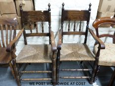 A pair of rush seated oak carver dining chairs