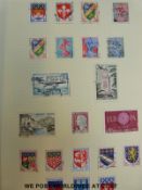 An all-world collection of stamps in four Simplex albums