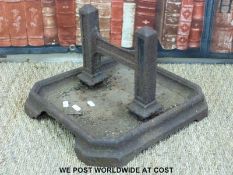 A 19thC cast iron foot scraper on base