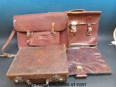 Four vintage brown leather satchels and wallets together with a small suitcase