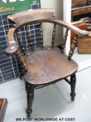 An oak captain's chair.