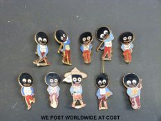 A collection of original Robertson's Golly badges to include the golfer, the bagpipe player,