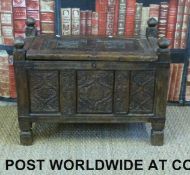 An Eastern pannelled storage trunk with lift up top and carved decoration (H57 x W80 x D39cm)