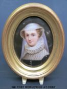 A portrait miniature on porcelain of a lady in period dress (maximum diameter 11.