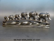 A group of carved hardwood elephants