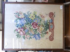 An embroidered fire screen featuring flowers and bird with initials K.M.